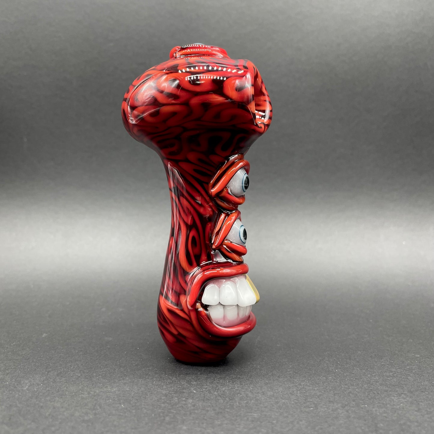 Close-up of Drain Bamage Spoon - handcrafted glass