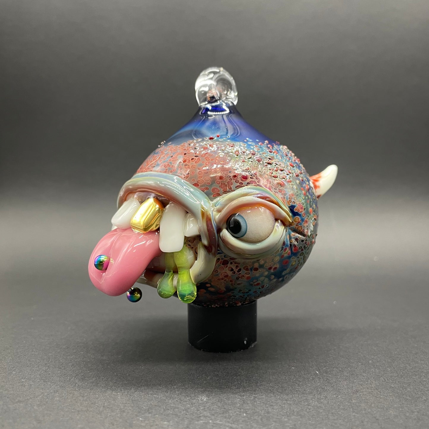 Hand-blown glass Pierced tongue cyclops ornament by Leviathan Glass