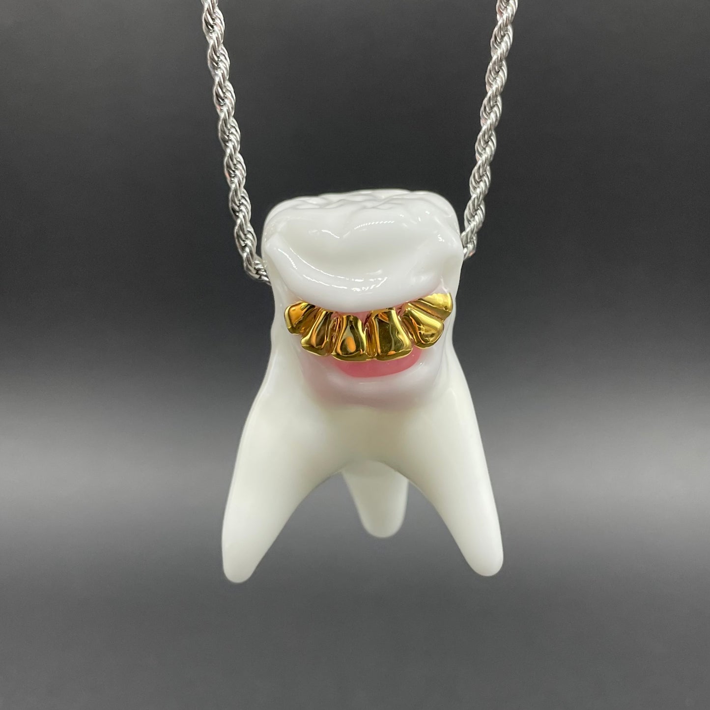 Hand-blown glass Tooth ache glass pendant by Leviathan Glass