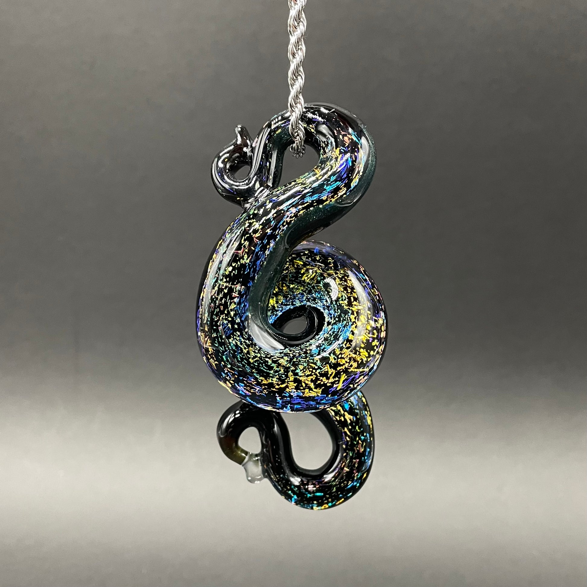 Hand-blown glass Dichroic rainbow sparkle snake pendant by Leviathan Glass