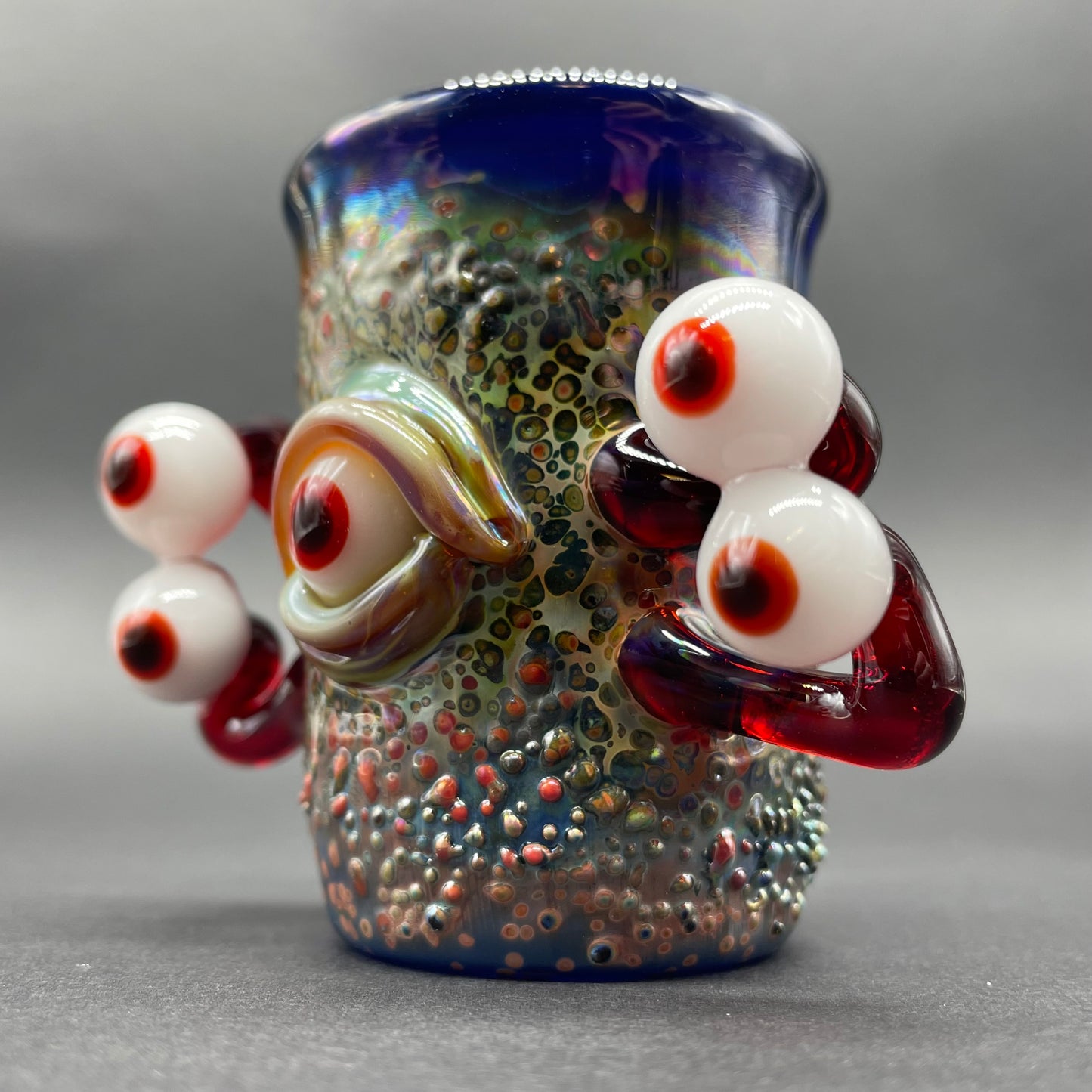 Close-up of Eyestalker shot glass - handcrafted glass