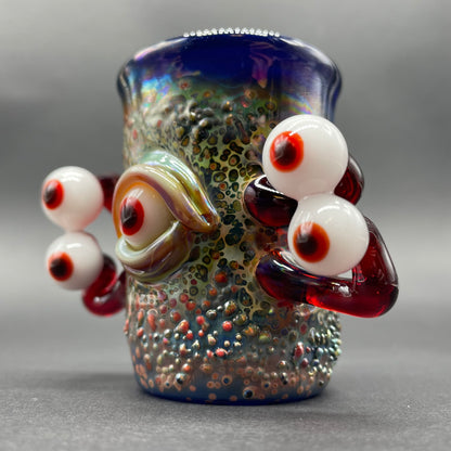 Close-up of Eyestalker shot glass - handcrafted glass