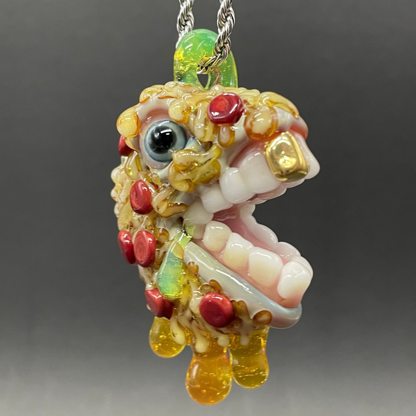 Close-up of Pizza fiend pendant - handcrafted glass