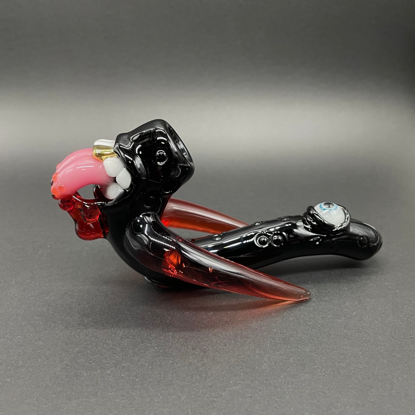 Hand-blown glass Red tusk Sherlock by Leviathan Glass