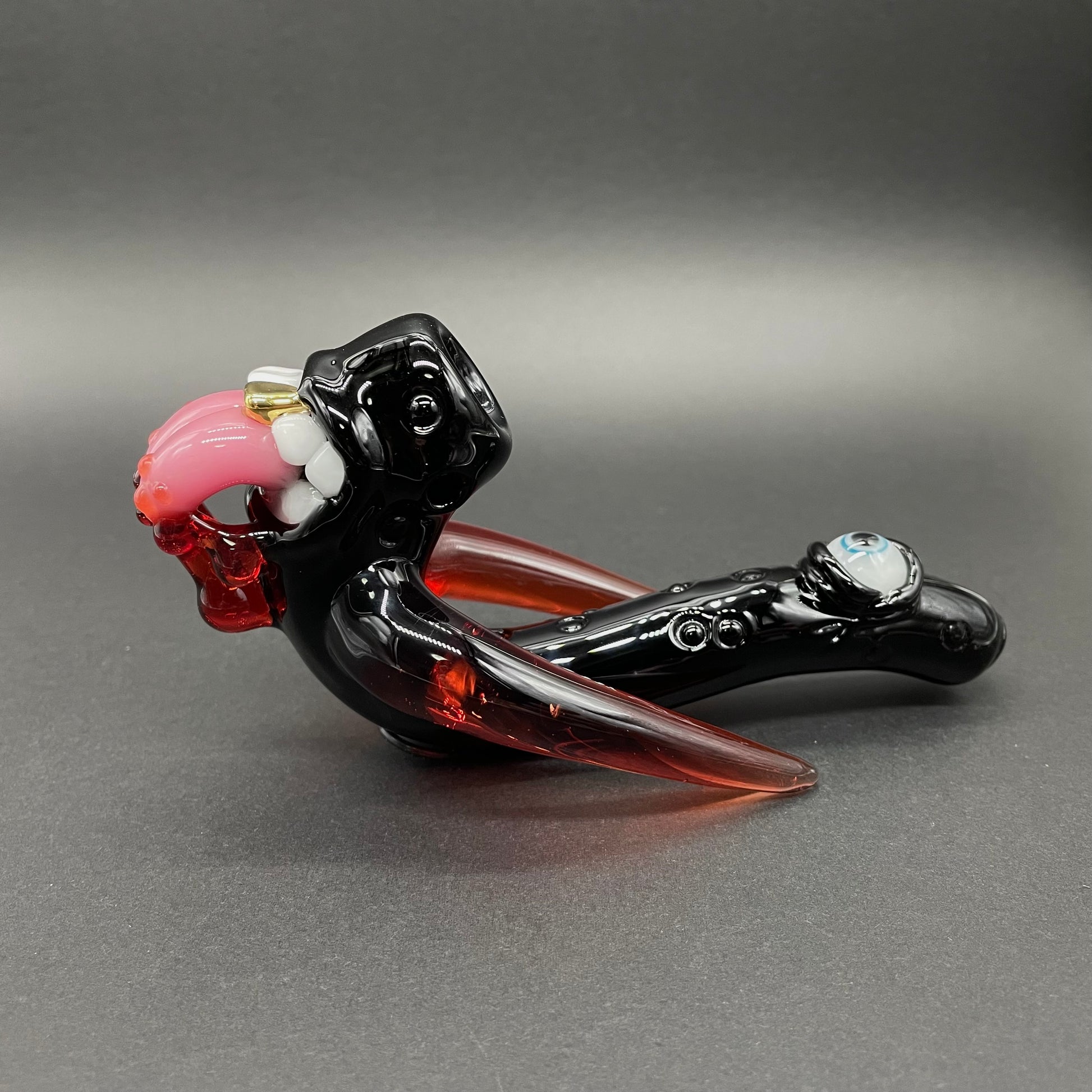 Hand-blown glass Red tusk Sherlock by Leviathan Glass