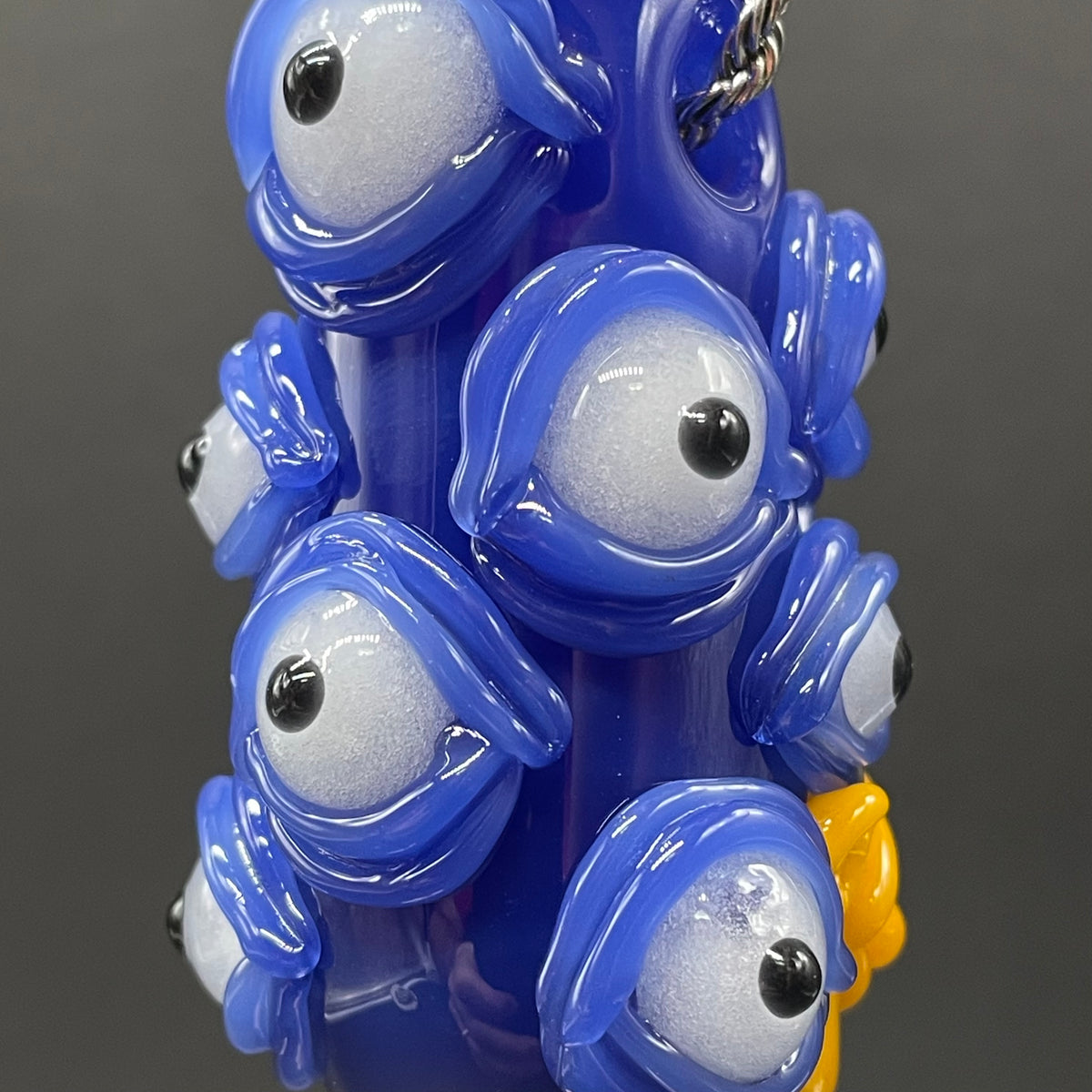 Marge Simpson Mutant handblown glass pendant - yellow Marge Simpson face with towering stack of blue cyclops creatures forming her hair, white pearl beads, silver rope chain - Leviathan Glass