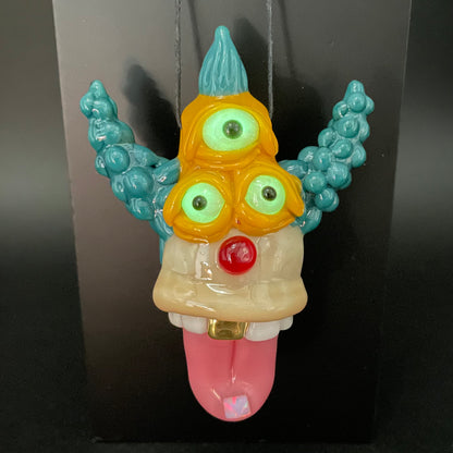 Krusty the Clown handblown glass pendant - Simpsons Krusty clown face with third eye, opal tab accent, white teeth, silver rope chain - Leviathan Glass