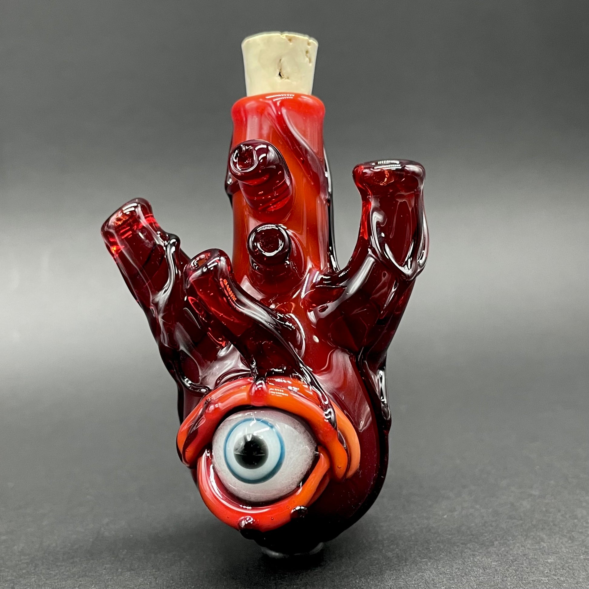 Close-up of Anatomical glass heart cork jar pendant - handcrafted glass