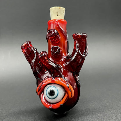 Close-up of Anatomical glass heart cork jar pendant - handcrafted glass