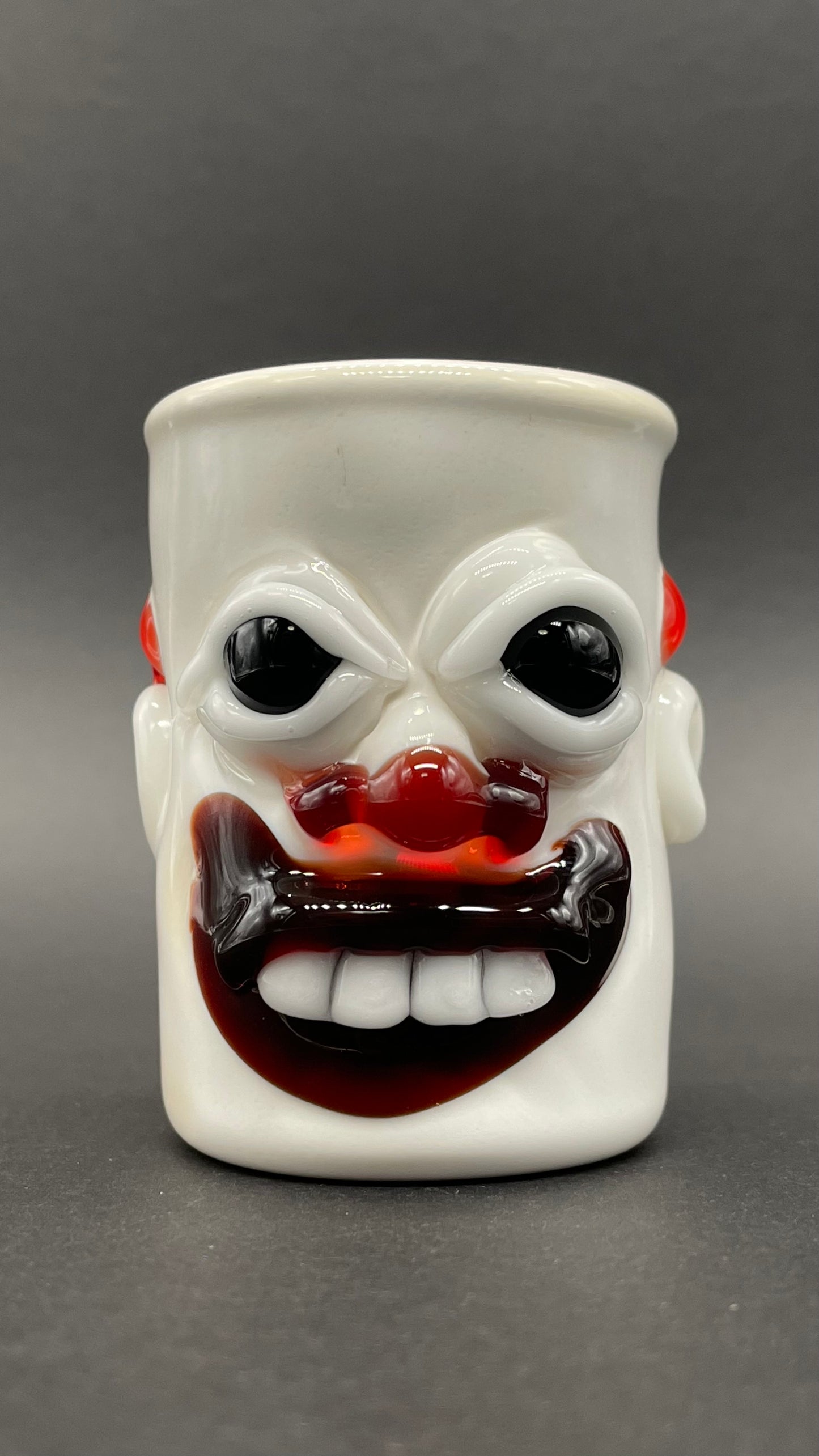 Nightmare fuel Evil clown shot glass detail view - premium glass art