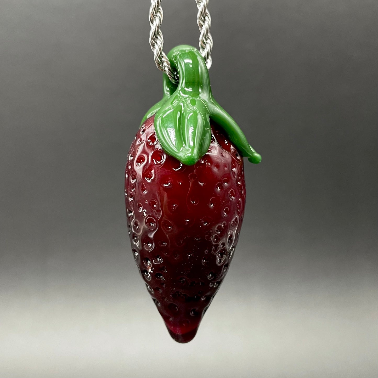 Close-up of Strawberry pendant - handcrafted glass