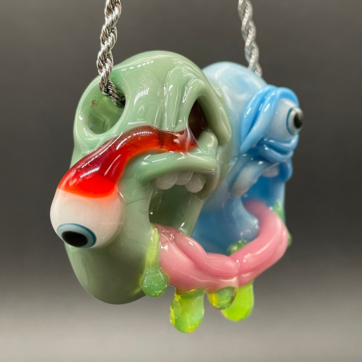 Close-up of Two headaches are better than one - handcrafted glass
