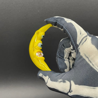 Grinning glass banana pendant