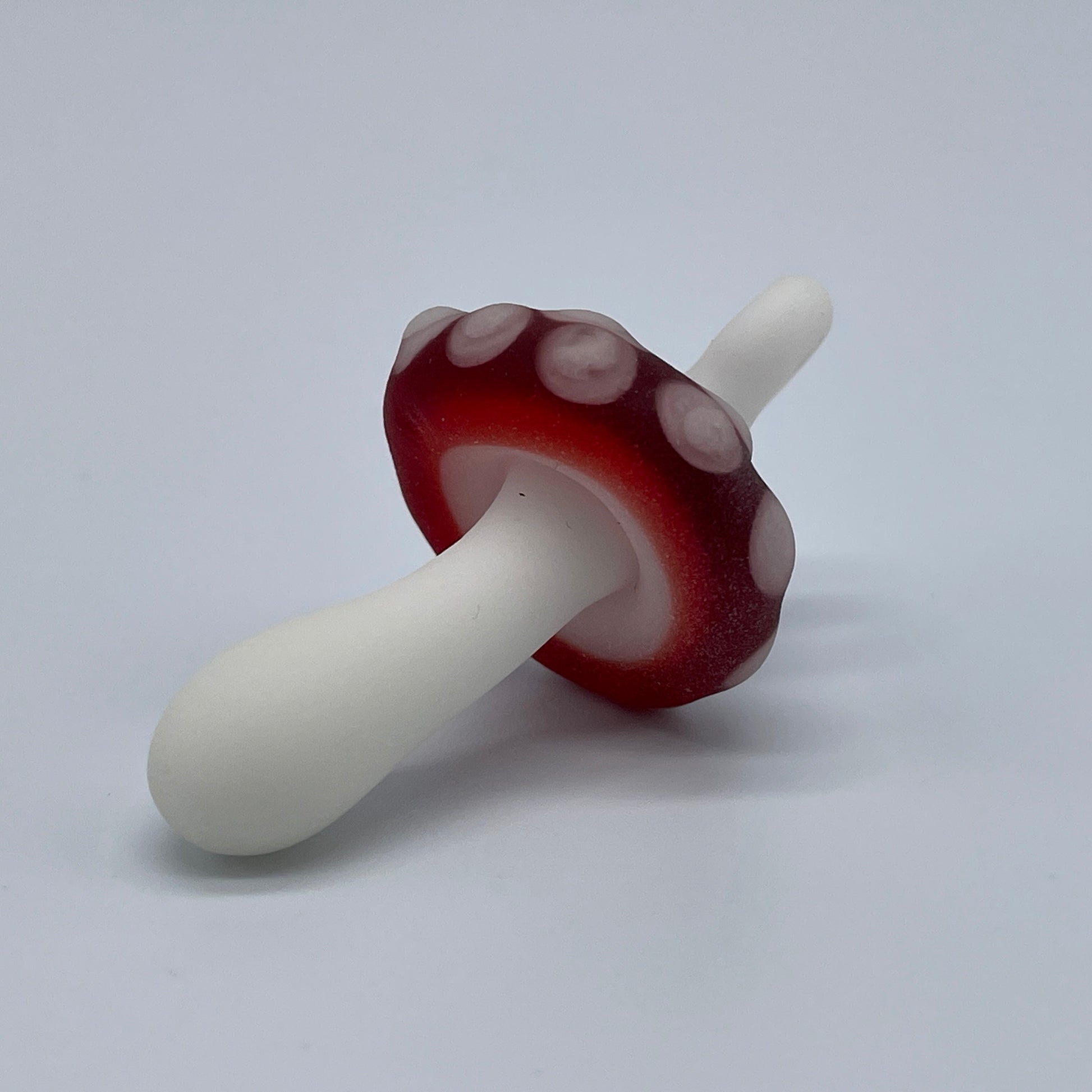 Red mushroom pendant by Leviathan Glass - artisan detail