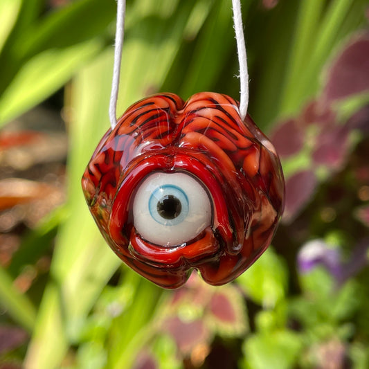 Cyclops brain pendant detail view - premium glass art