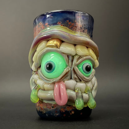 Close-up of Hungry eyes monster shot glass - handcrafted glass