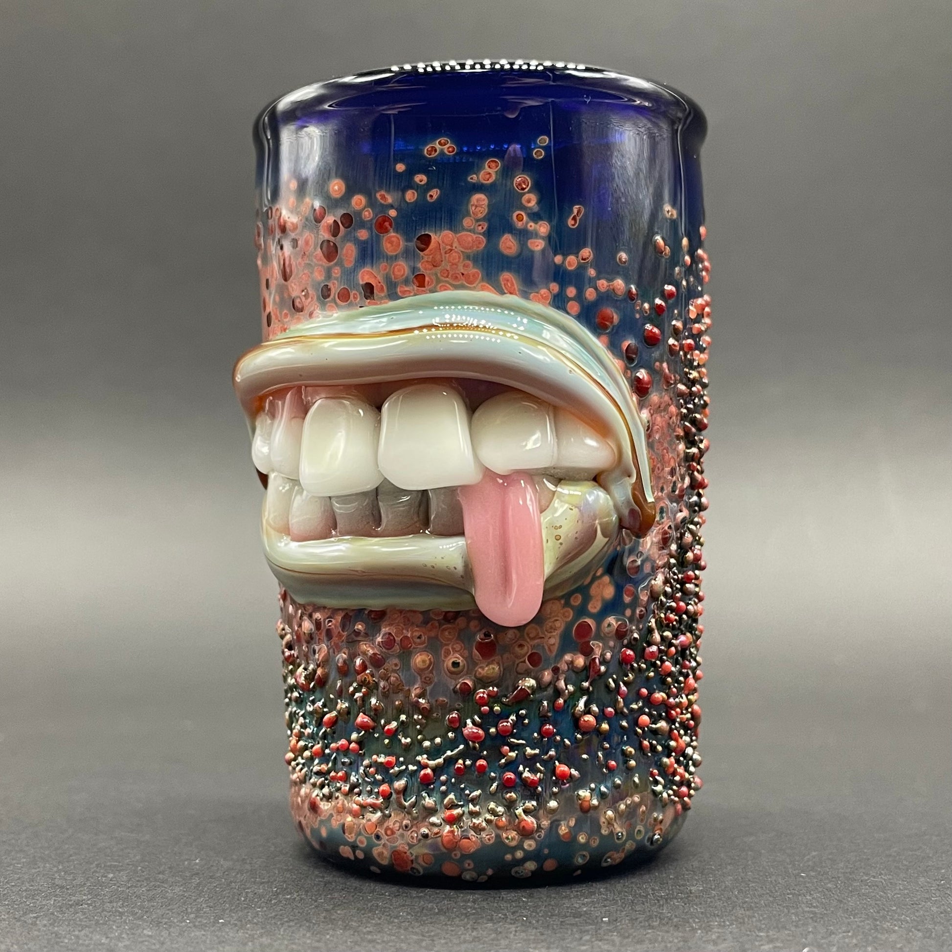 Close-up of MOUTH shot glass - handcrafted glass