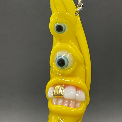 Grinning glass banana pendant