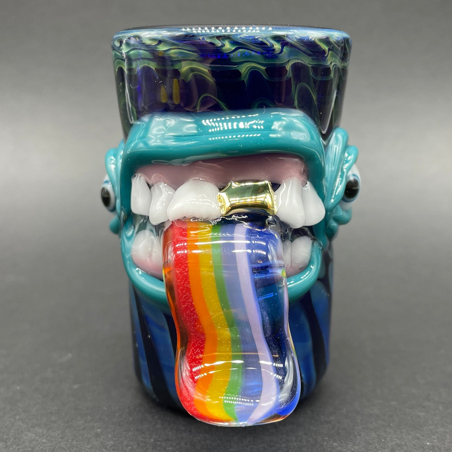 Hand blown kool AID tongue shot glass with gold tooth craftsmanship - artisan glass work