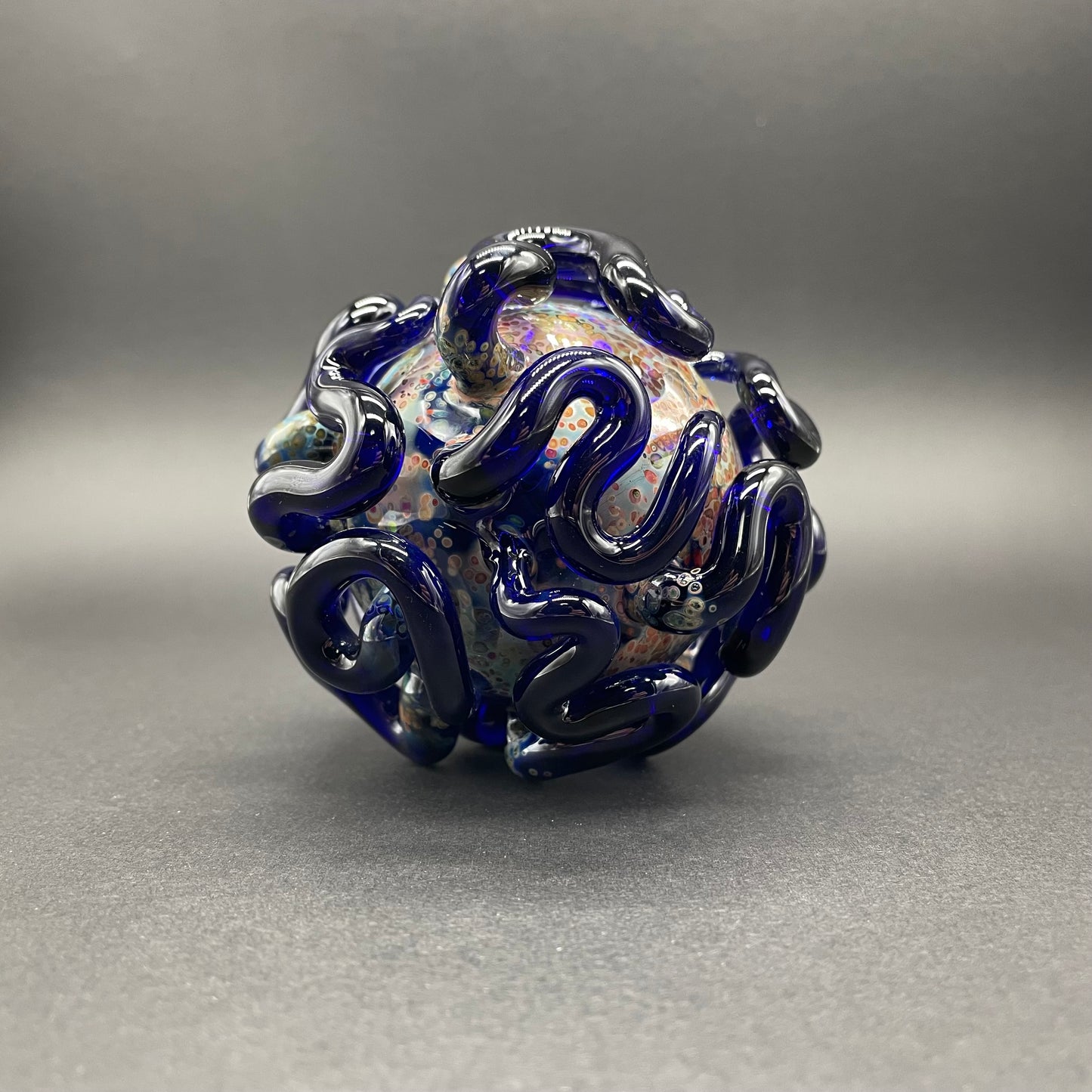 Hand-blown glass Worm Globe ornament by Leviathan Glass