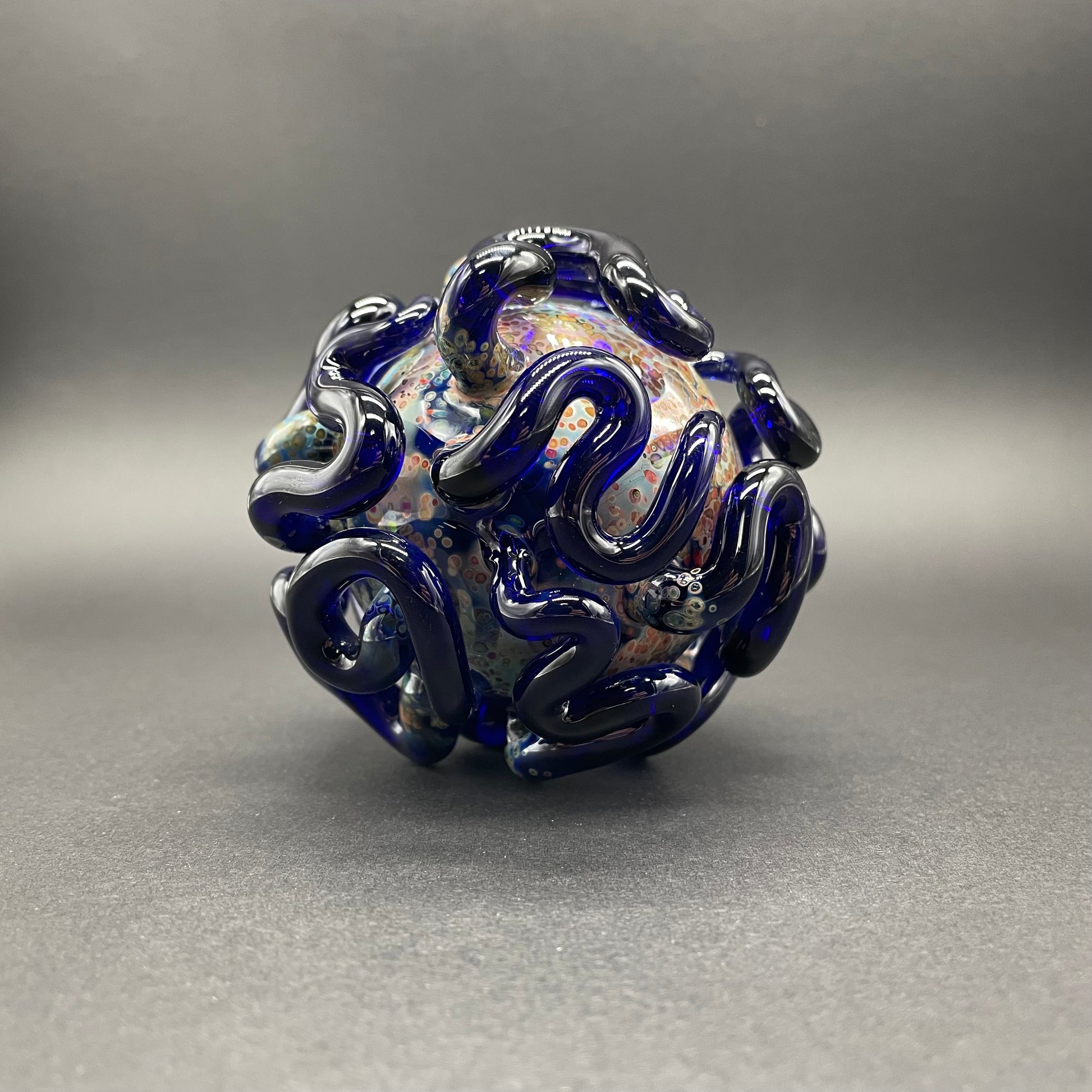 Hand-blown glass Worm Globe ornament by Leviathan Glass