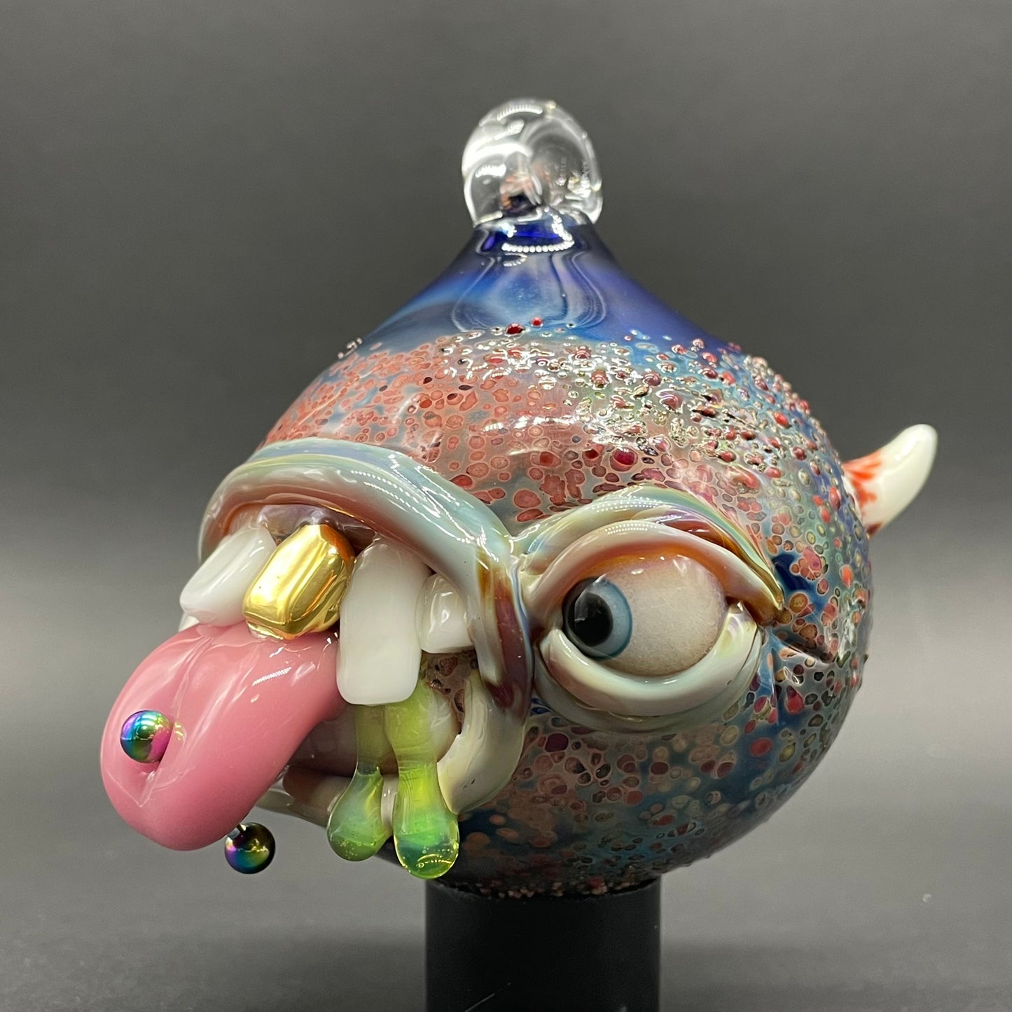 Pierced tongue cyclops ornament detail view - premium glass art