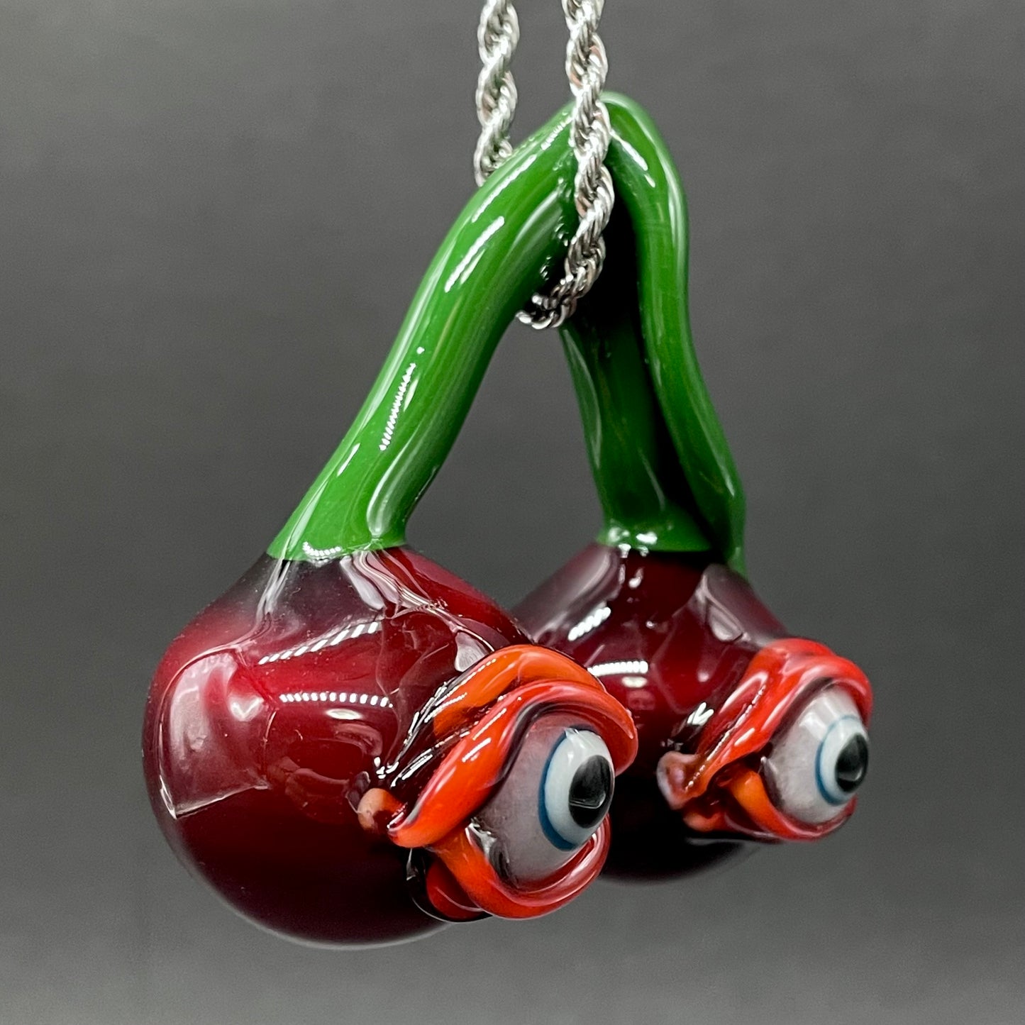 Cherry flavored glass eye pendant