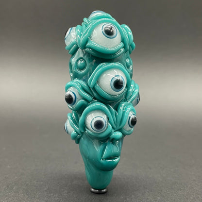 The Never-Blinking One glass effigy pendant craftsmanship - artisan glass work