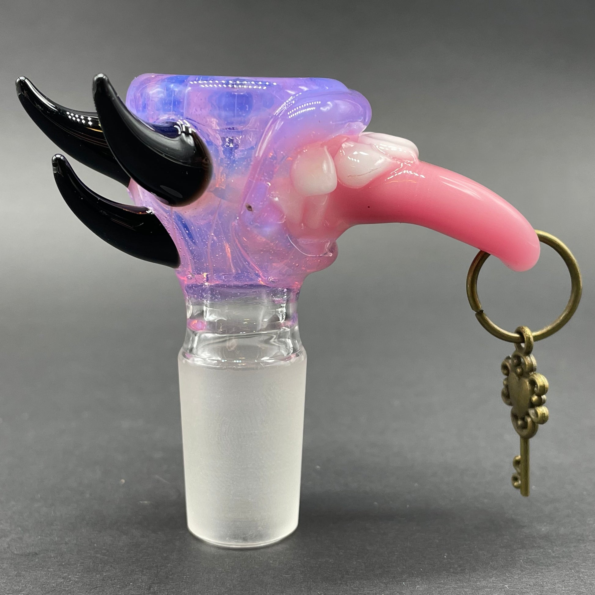 Close-up of 18mm 4 hole Pierced tongue slide - handcrafted glass