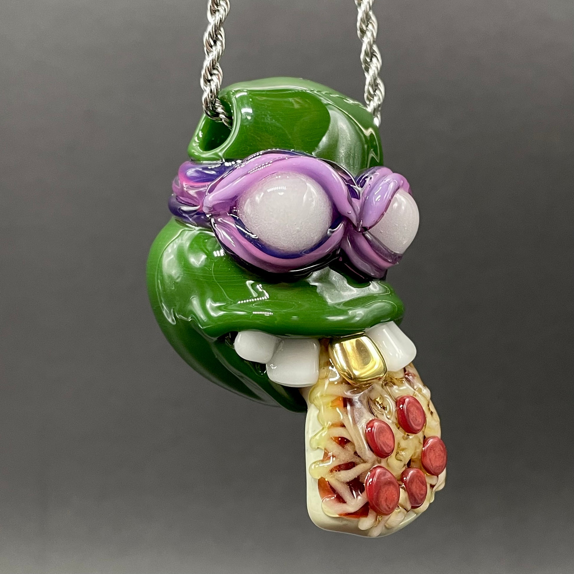 Close-up of Glass Donatello ninja turtle pendant - handcrafted glass