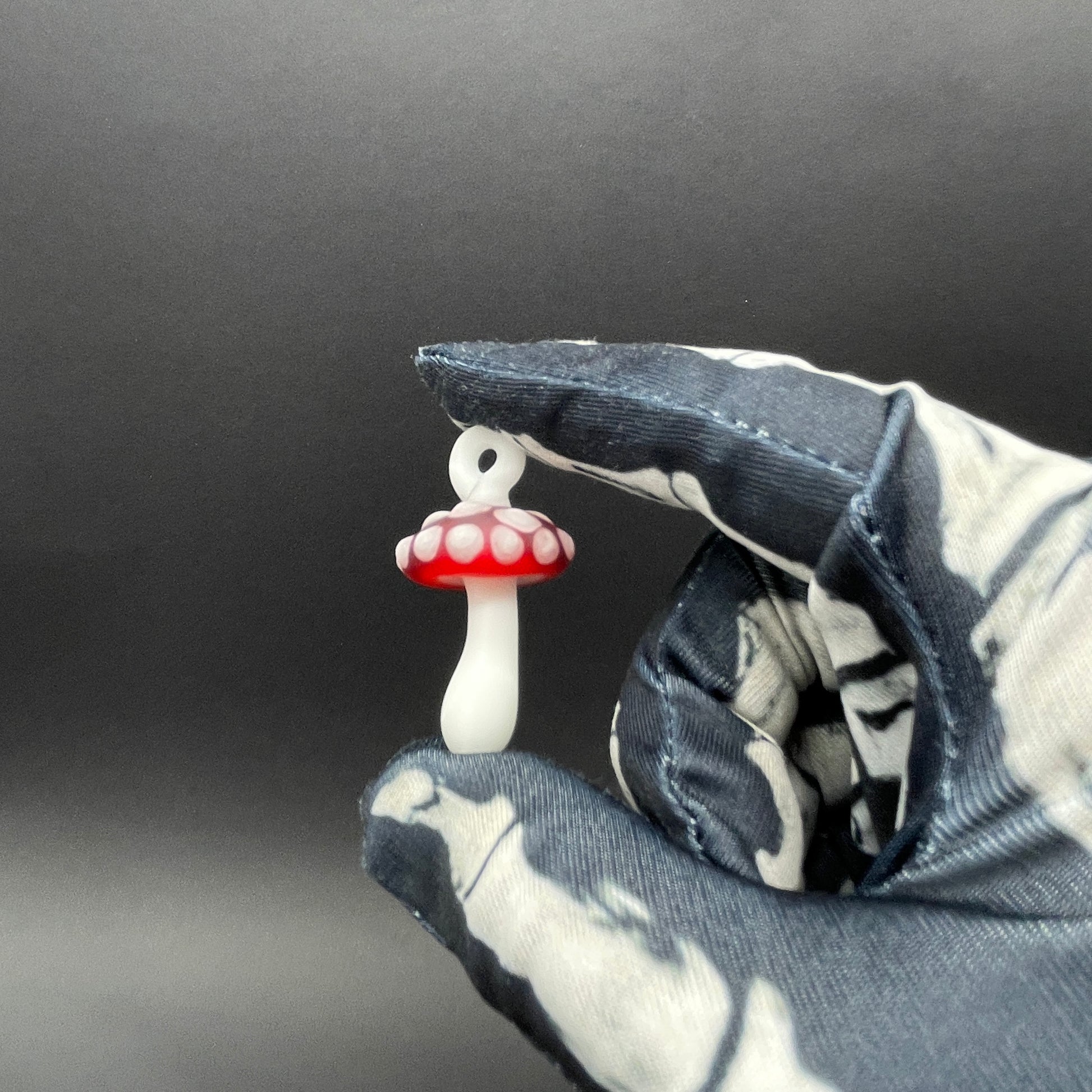 Red mushroom pendant detail view - premium glass art