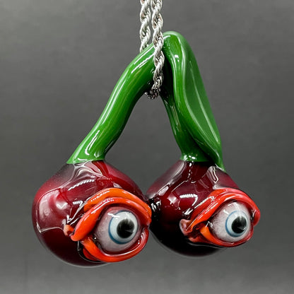 Cherry flavored glass eye pendant