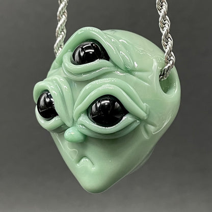 Time manipulating three eye glass alien pendant