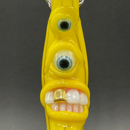 Grinning glass banana pendant