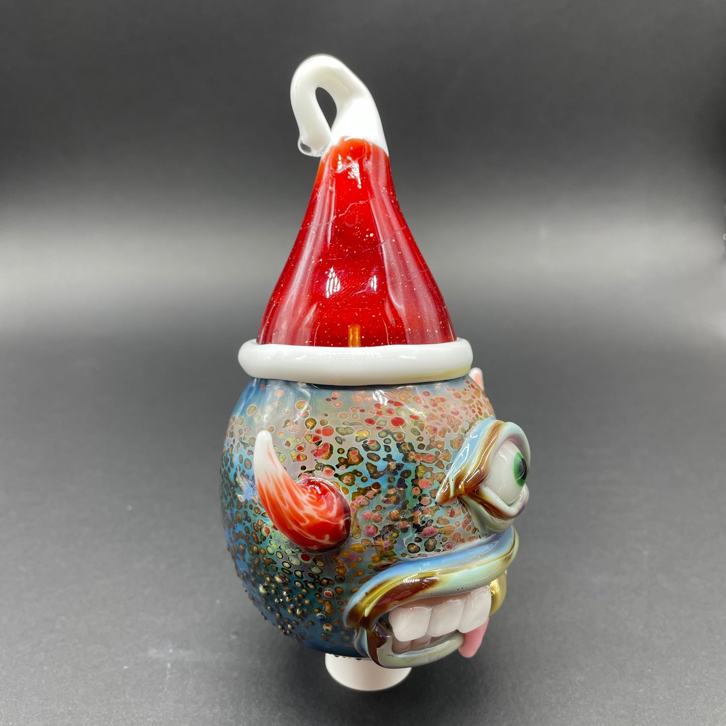Leviathan Glass Santa hat cyclops ornament - hand-blown art