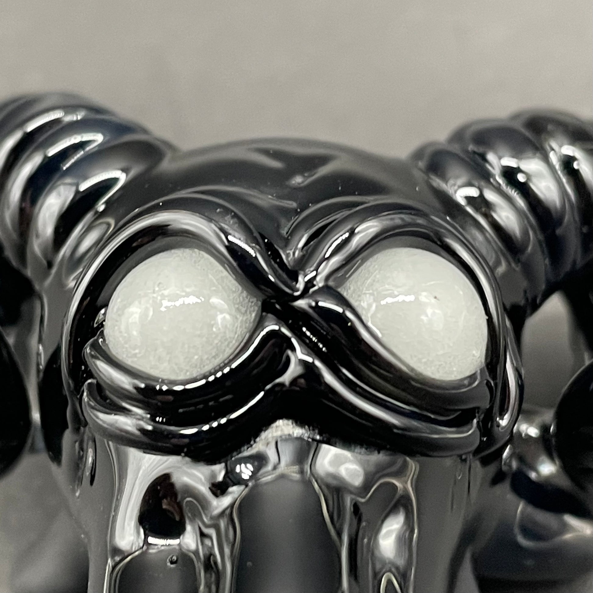 Close-up of Black Philip pendant - handcrafted glass