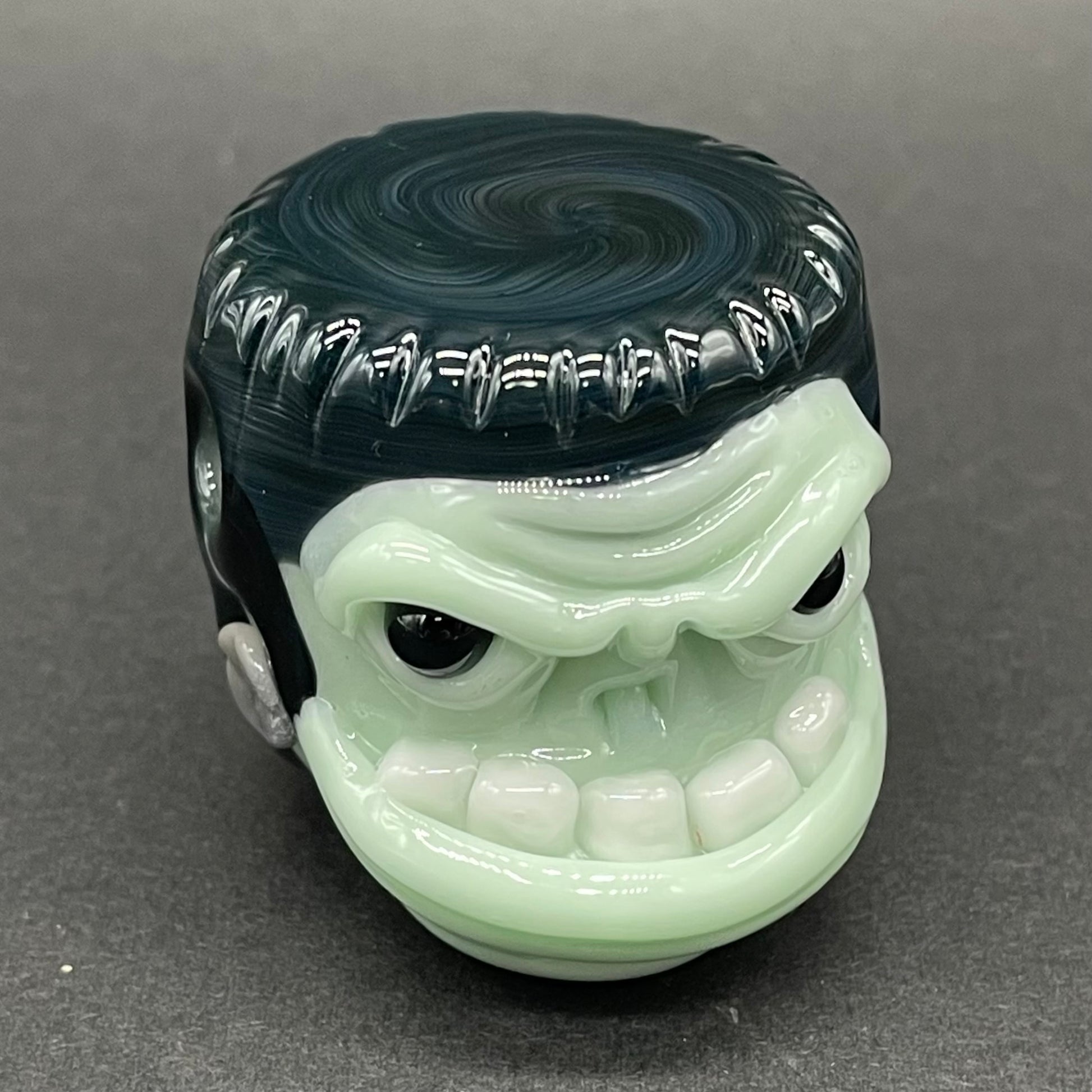 Close-up of Glass Frankenstein pendant - handcrafted glass