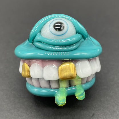 Grinning Like a Fool handblown glass pendant - oversized grinning monster face, white teeth, gold tooth, opal accents, silver rope chain - Leviathan Glass