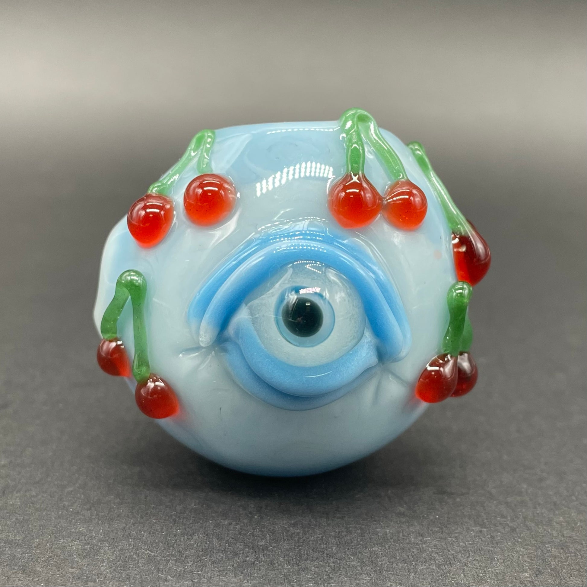 Close-up of Cherry bomb spoon - handcrafted glass