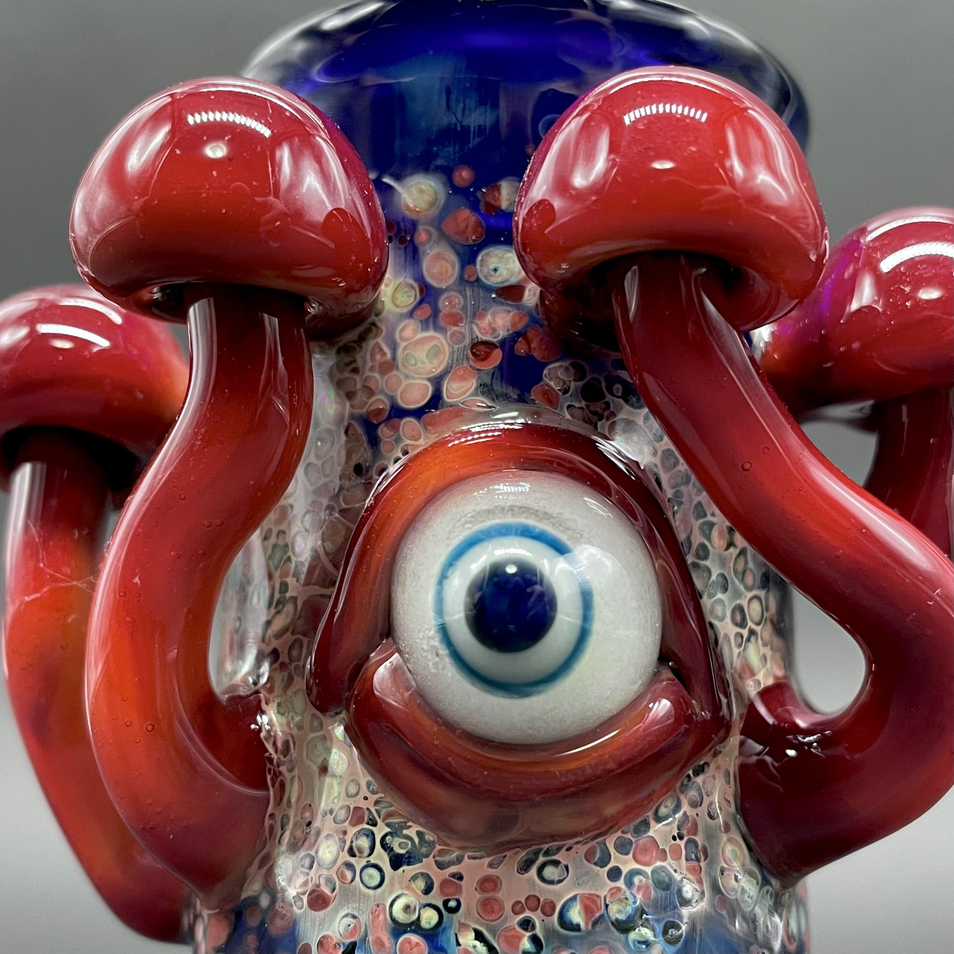 Close-up of Tequila sunrise shot glass - handcrafted glass
