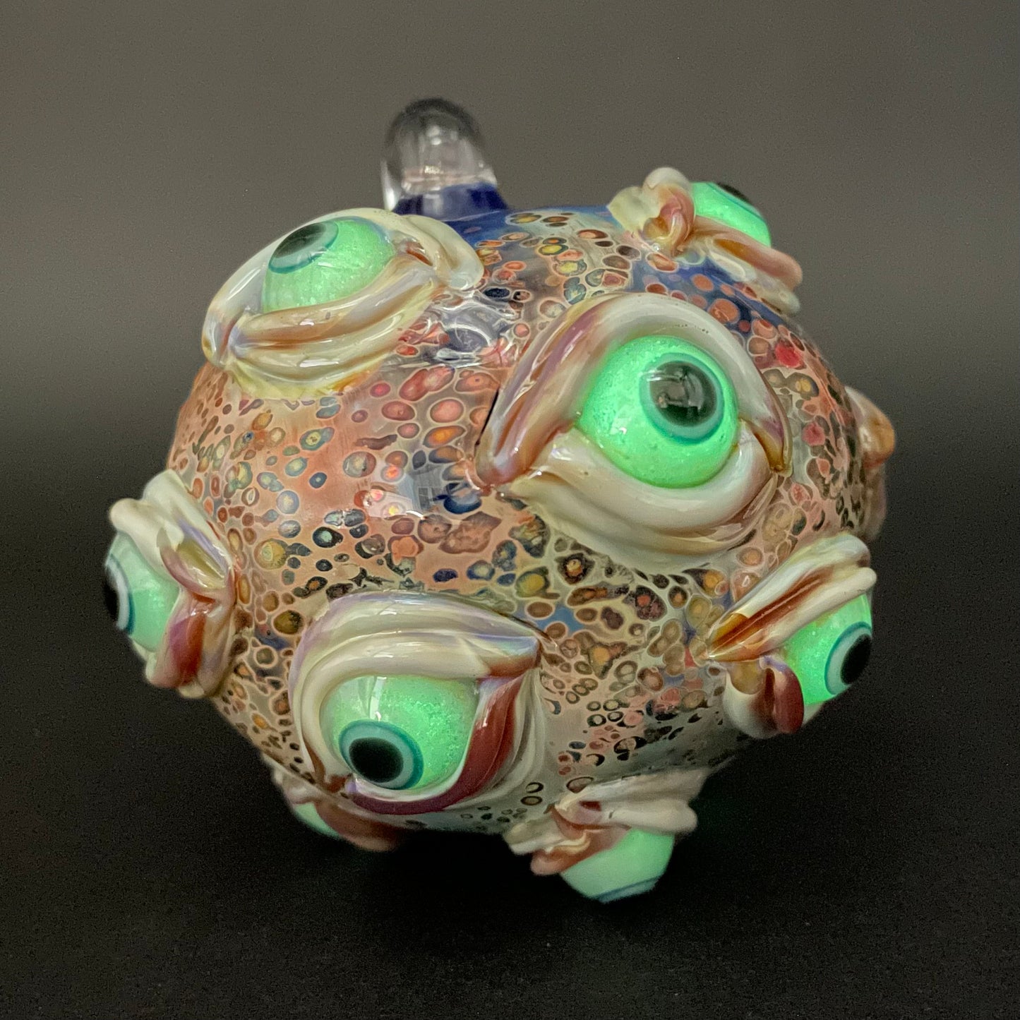 Close-up of All seeing Argus ornament - handcrafted glass