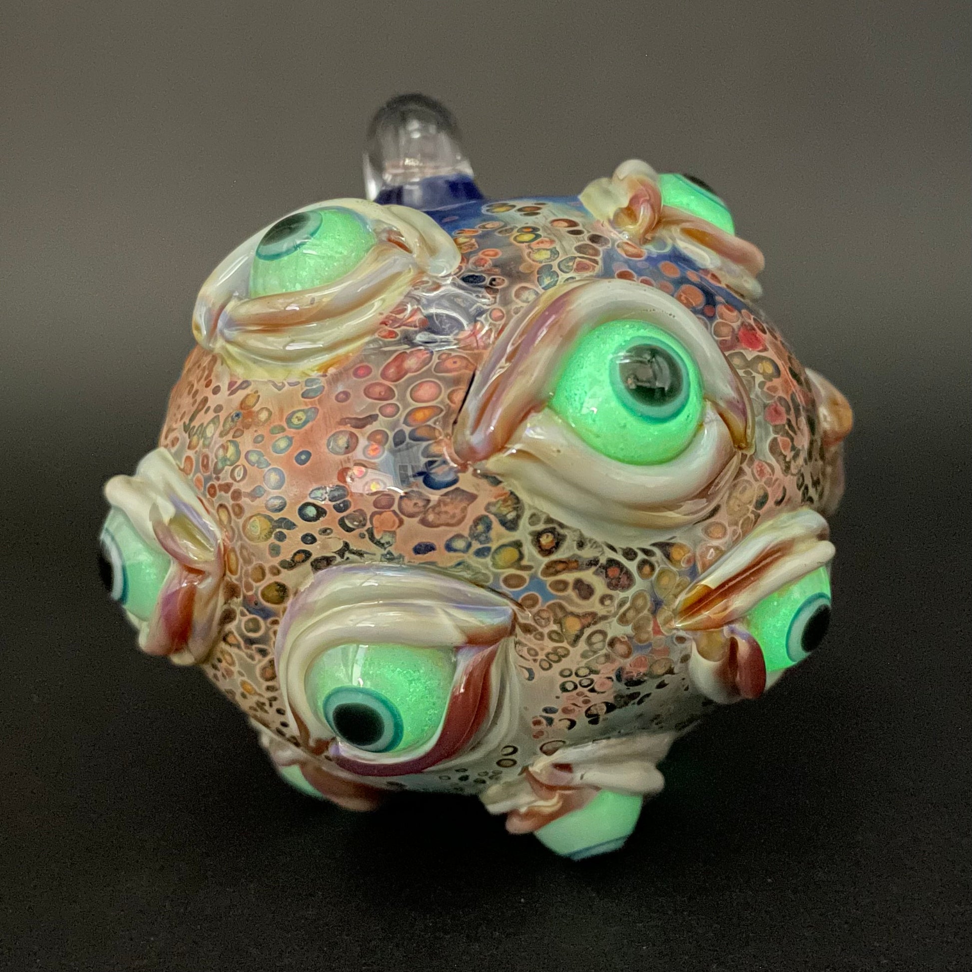Close-up of All seeing Argus ornament - handcrafted glass