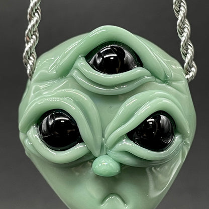 Time manipulating three eye glass alien pendant