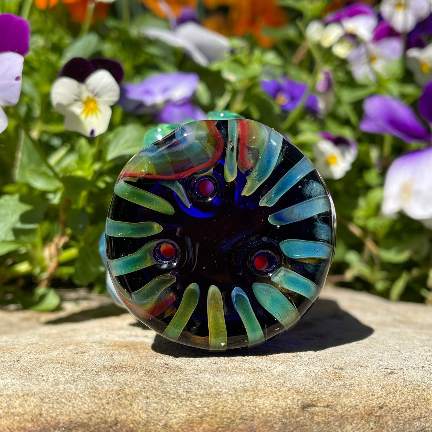 Rainbow cyclops plant pot with drainage holes detail view - premium glass art