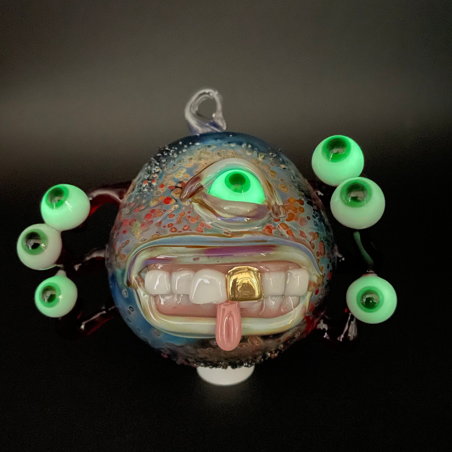 Close-up of Eye stalk monster ornament - handcrafted glass