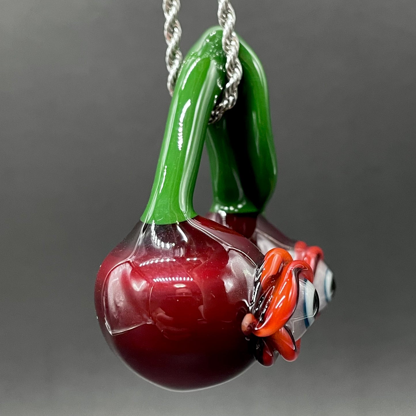 Cherry flavored glass eye pendant