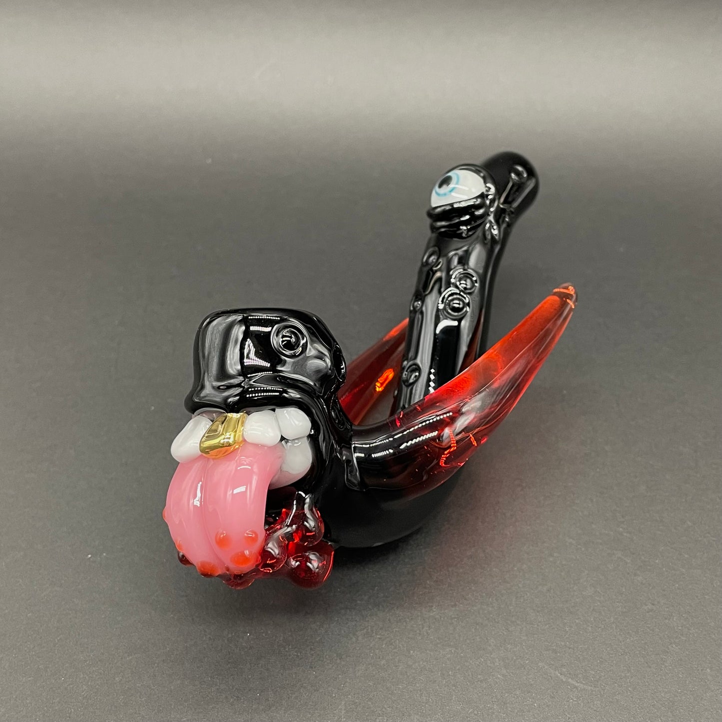 Close-up of Red tusk Sherlock - handcrafted glass