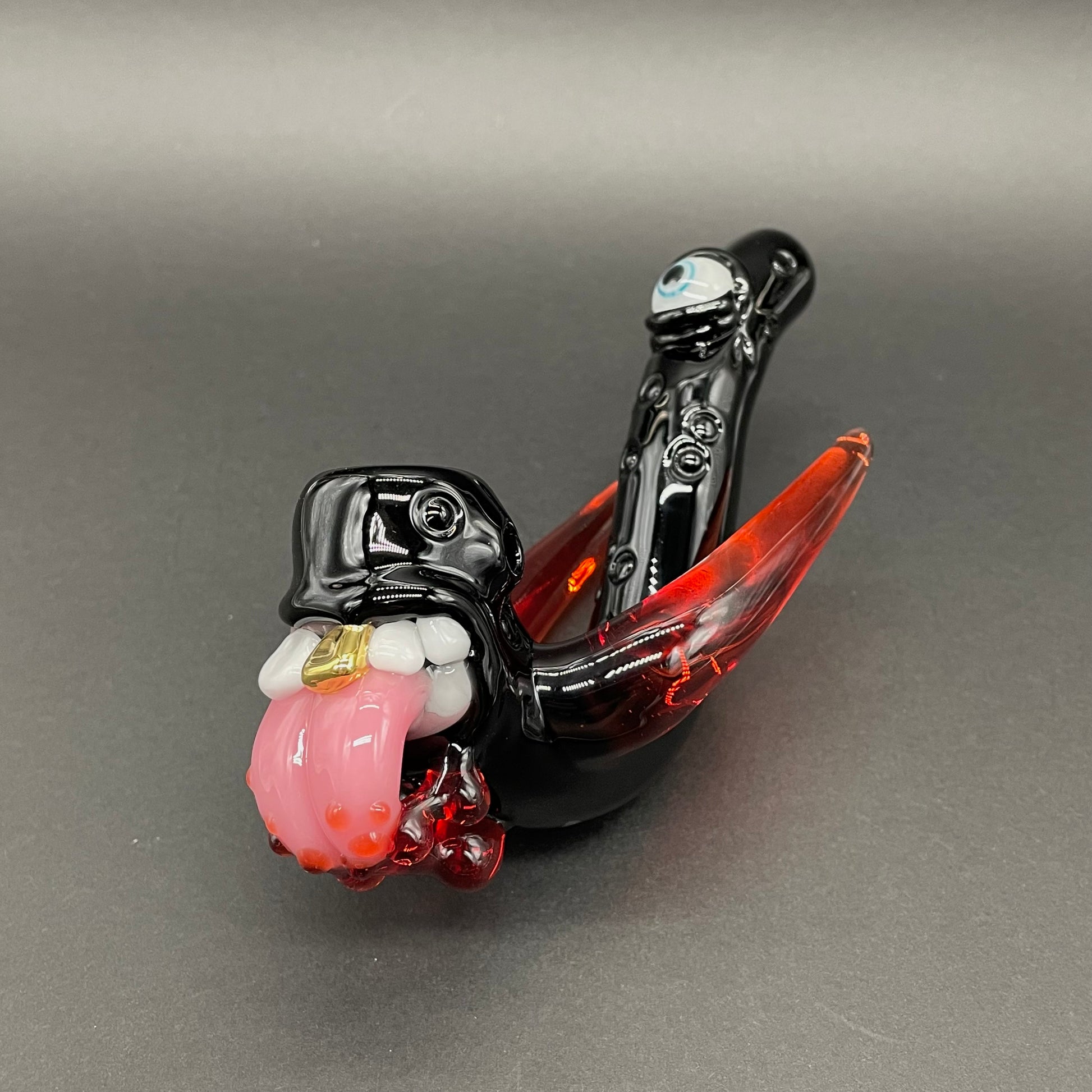 Close-up of Red tusk Sherlock - handcrafted glass
