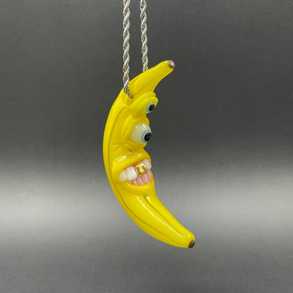 Grinning glass banana pendant