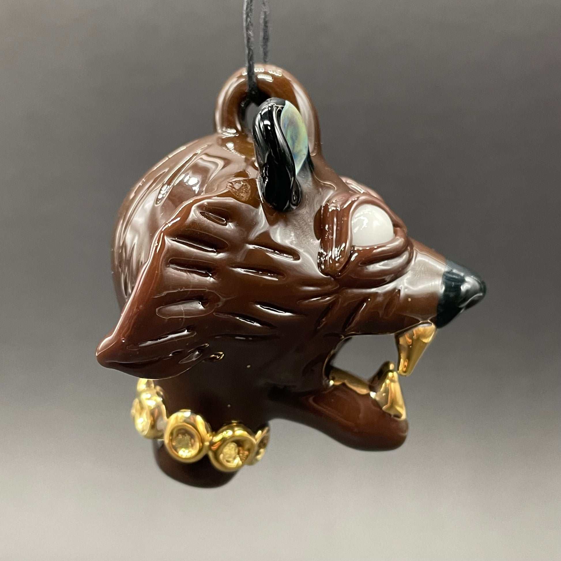 Close-up of blinged out glass grizzly bear pendant - handcrafted glass